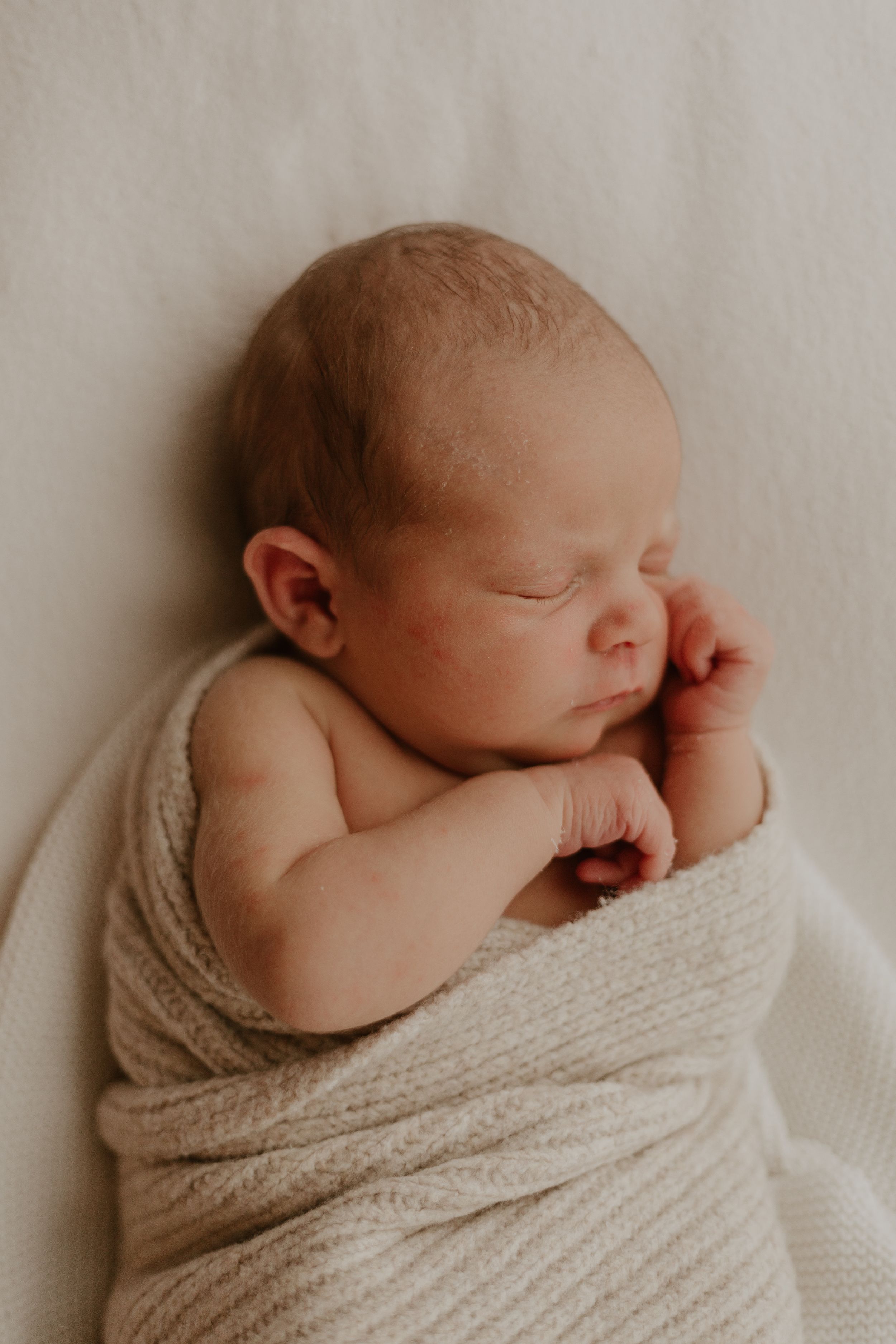cosy natural photography of newborn baby in Kent