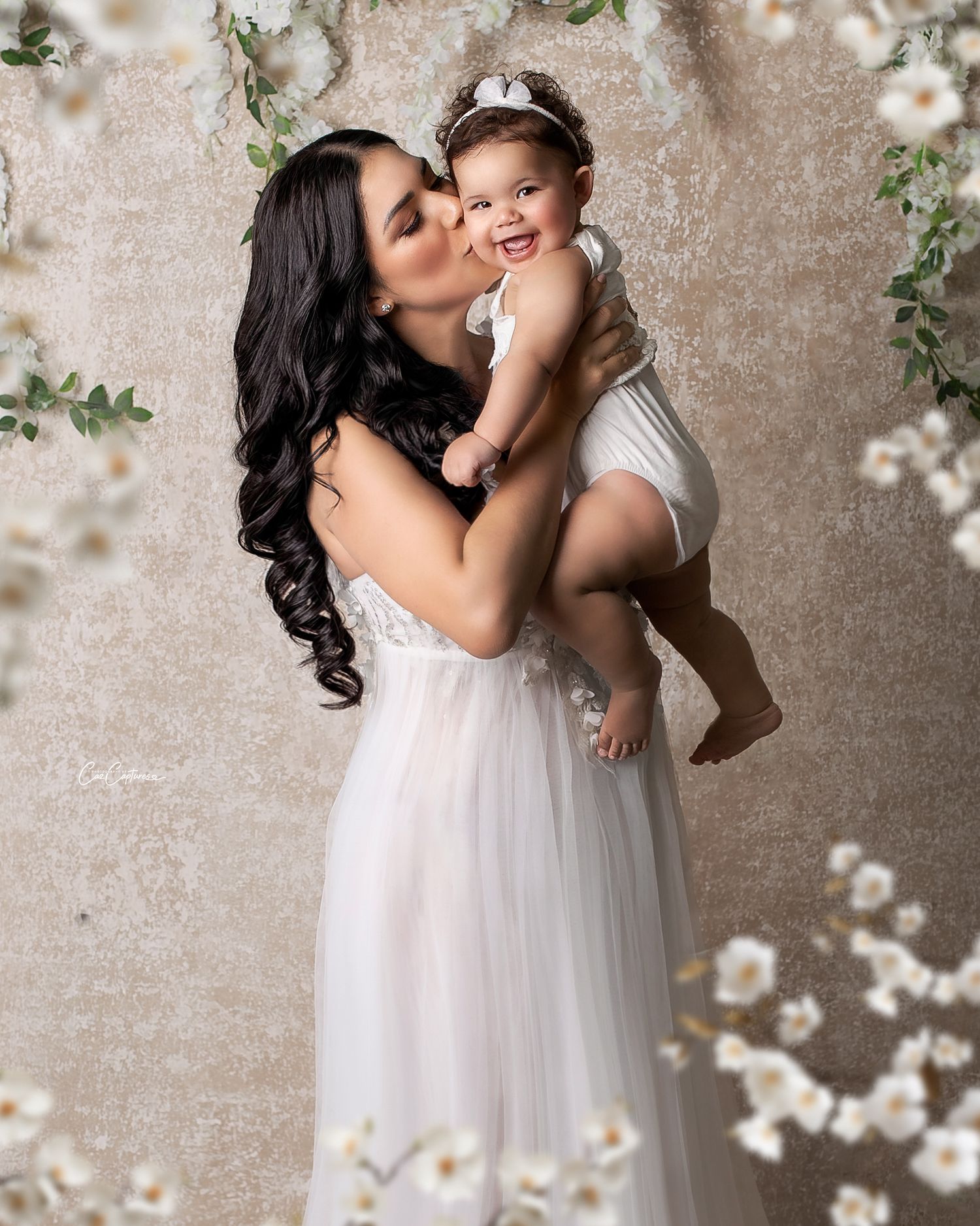 Artistic silhouette of a mother and child in the studio, light emphasizing their connection.