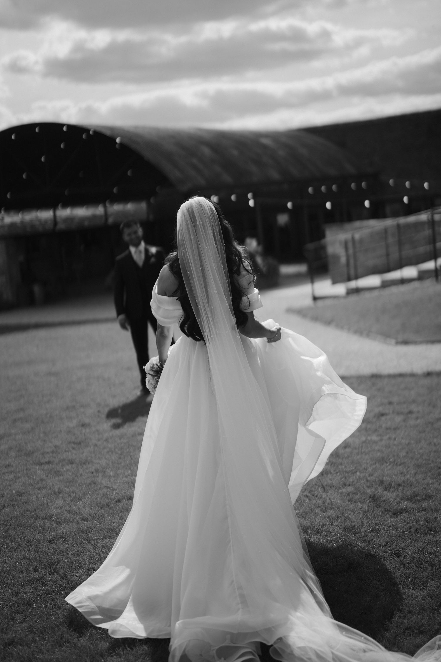 bride walking towards groom at yardspace old gore in cirencester