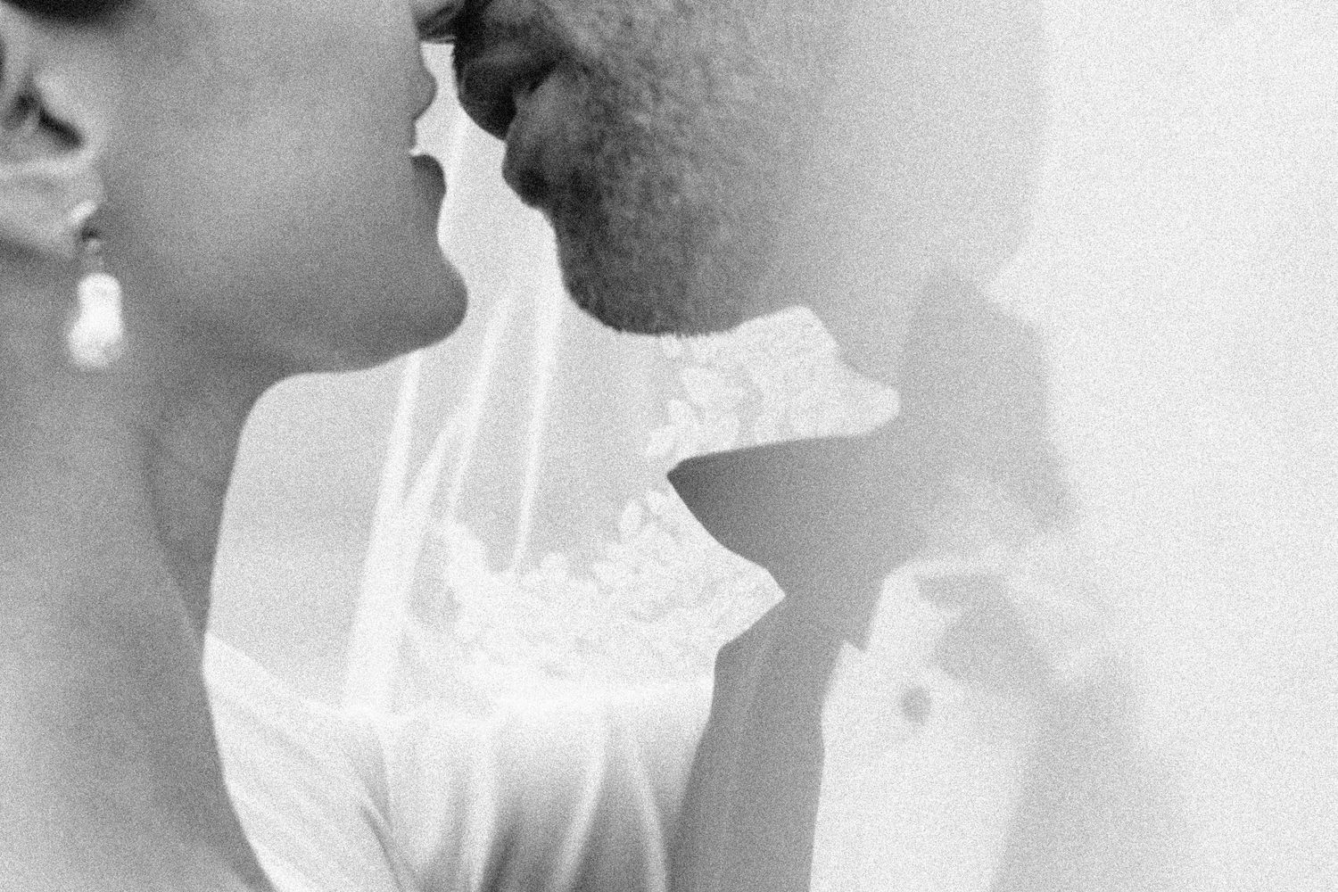 Black and white photo of an intimate and sensual moment between a bride and groom on their wedding day in Chicago