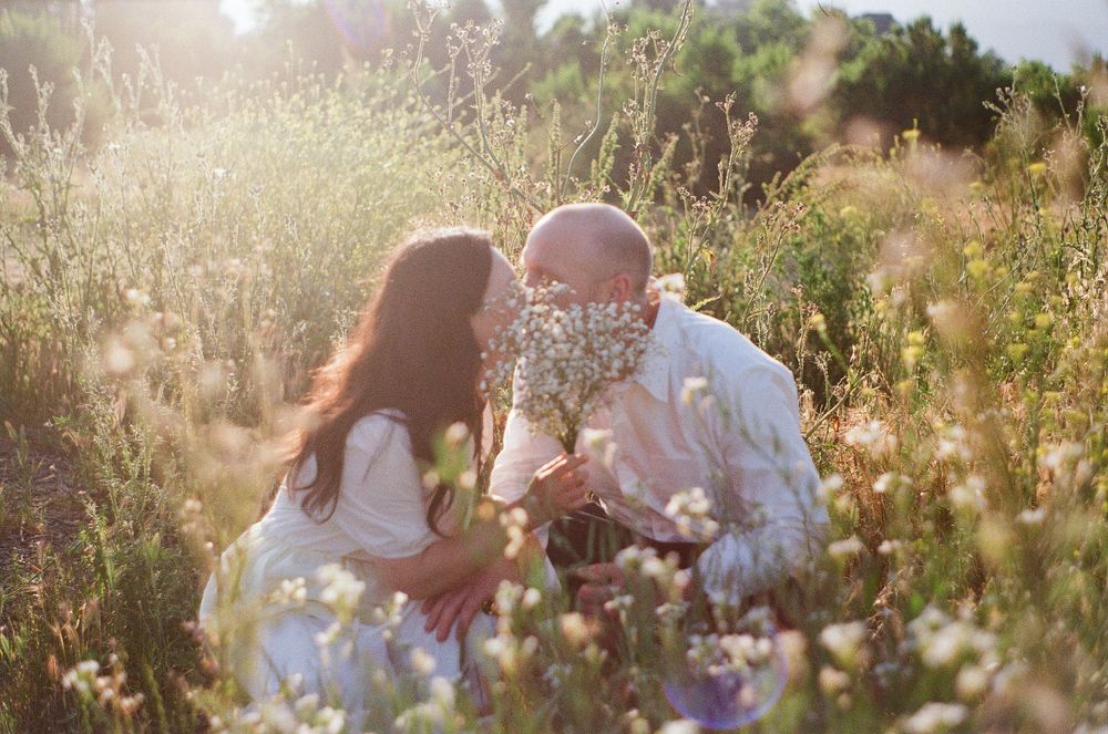 Romantic Ojai engagement photography on film with dramatic mountain views and wild grasses.