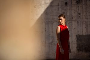 Kirstie Fitzpatrick, weather presenter and Journalist from 7 News Regional wearing a red dress at the Mount Stromlo Observatory