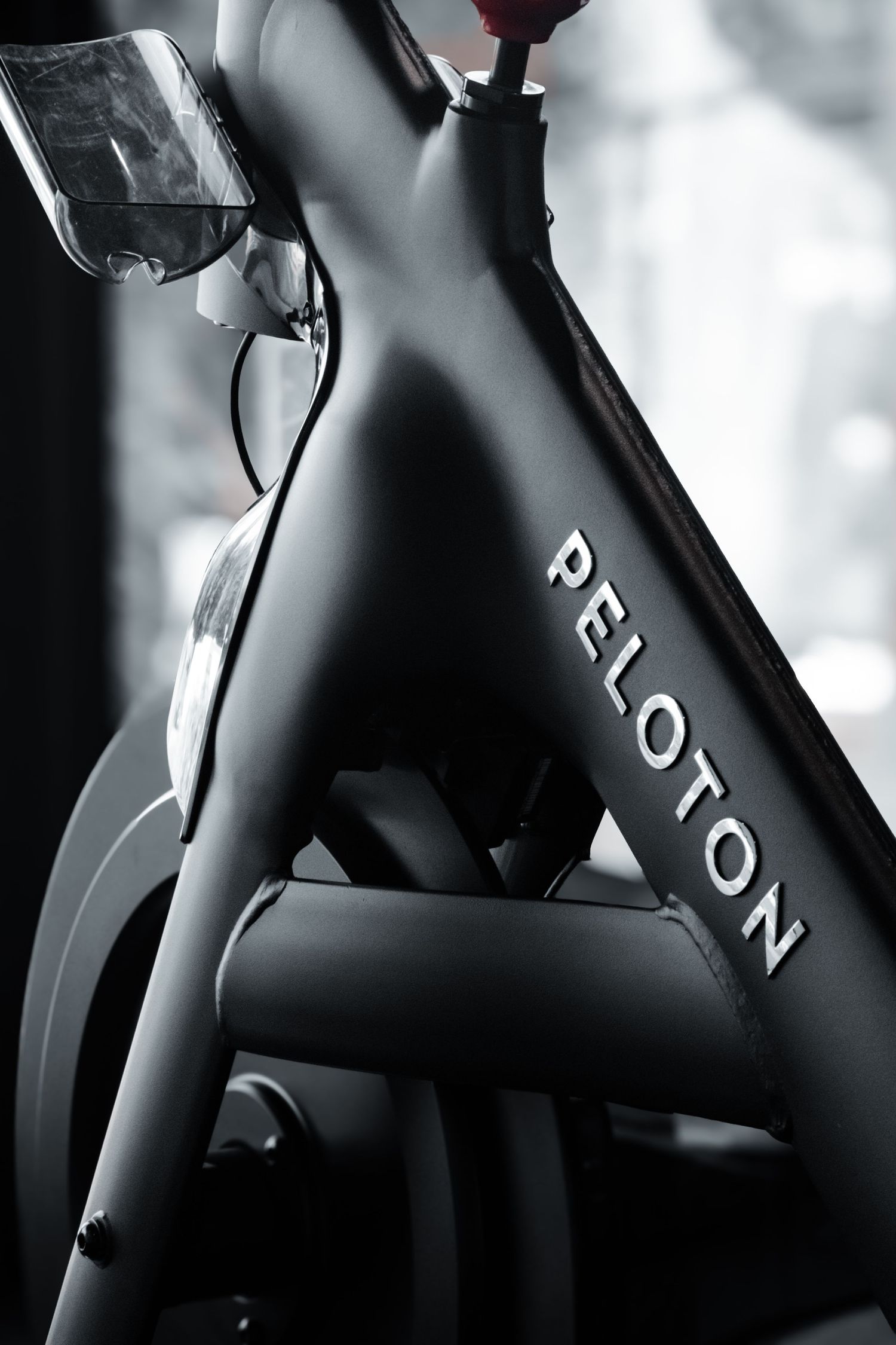 Stylish image of a Peloton bike in a gym