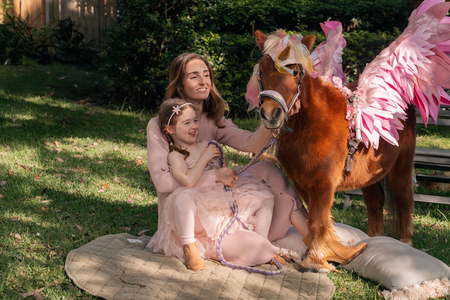 mom and daughter with a unicorn during a photoshoot in Lane Cove sydney