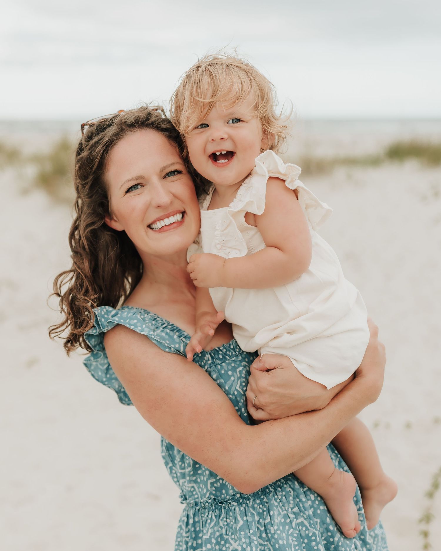 A heartwarming series of candid beach moments showing affectionate interactions in the soft coastal light.