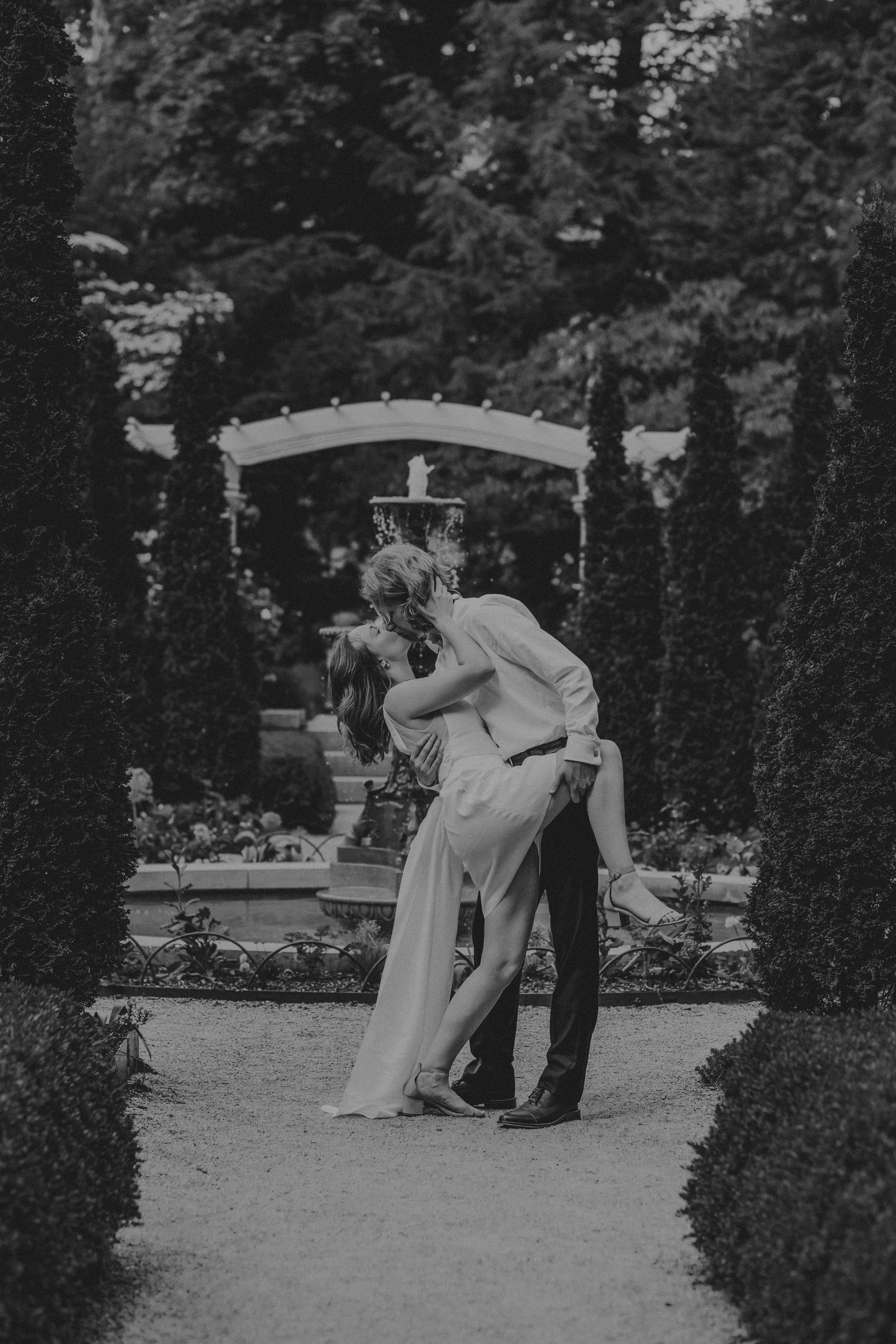 Black and white photo sequence showing a couple dancing and dipping in an outdoor garden setting.