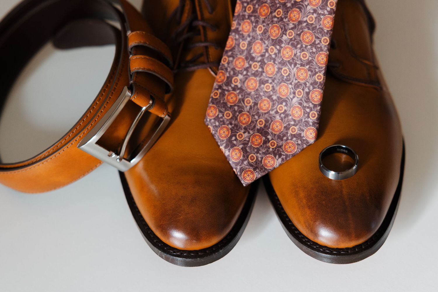 Ohio groom's shoes, tie and wedding ring.