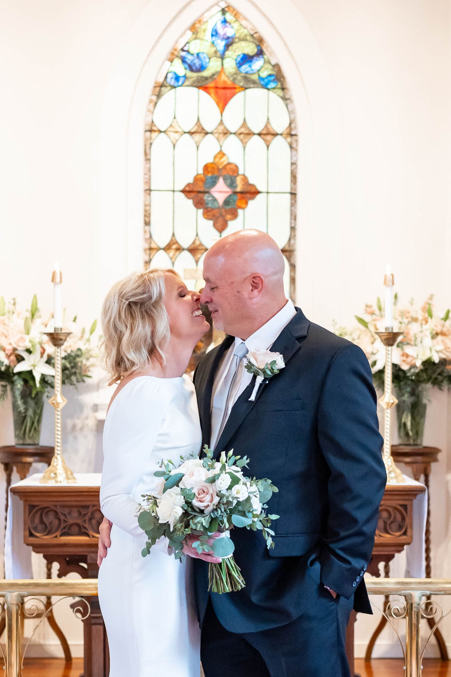 bride and groom kiss at Christ's Episcopal Church in Convington, LA