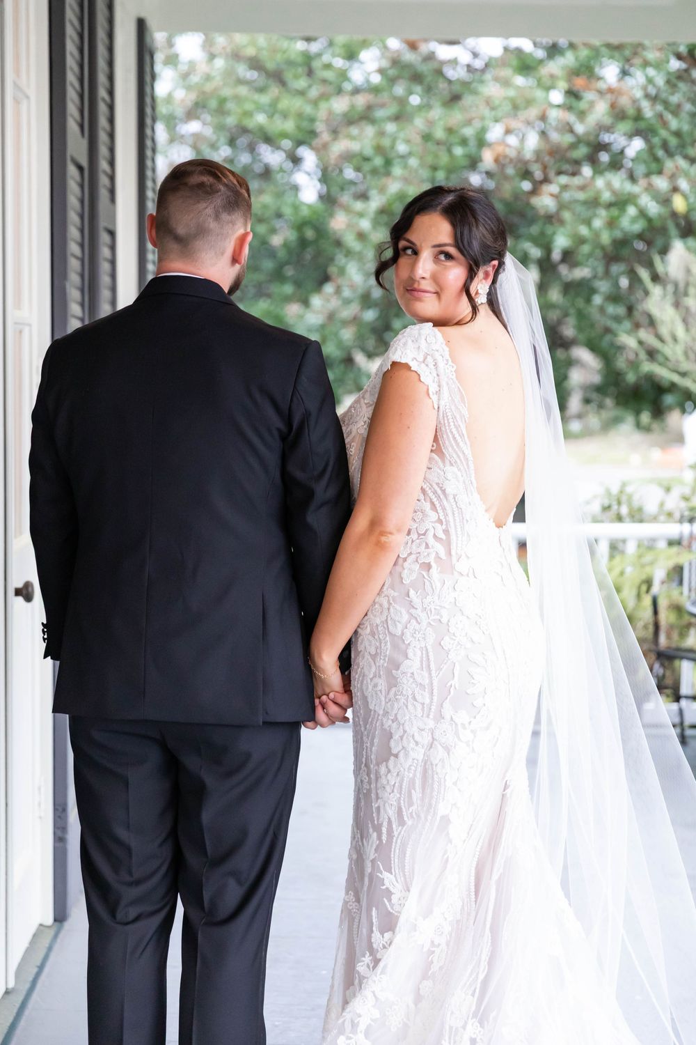 bride looks back