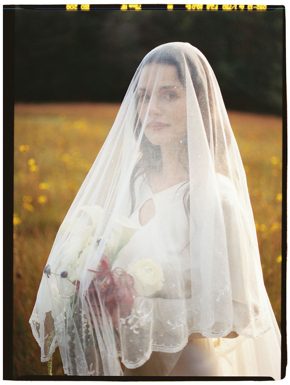 Ethereal bridal portraits showing a figure in white under a sheer veil in golden sunlight.
