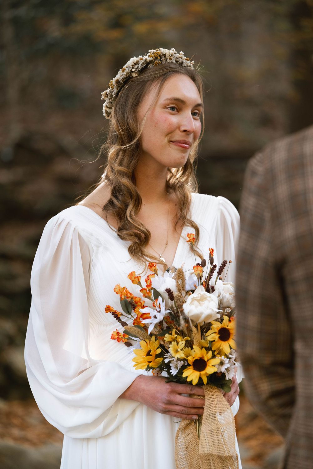 a picture of a bride looking at her husband during their wedding ceremony