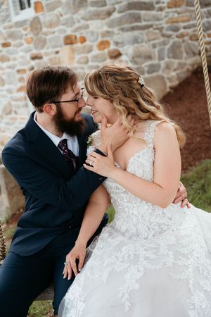 A romantic wedding photo sequence showing a couple in formal attire sharing tender kisses against a stone wall backdrop.