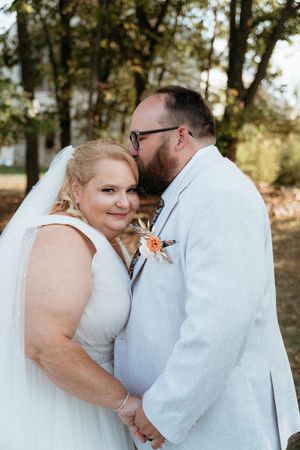 A series of romantic wedding photos showing tender moments between a couple in white attire outdoors.