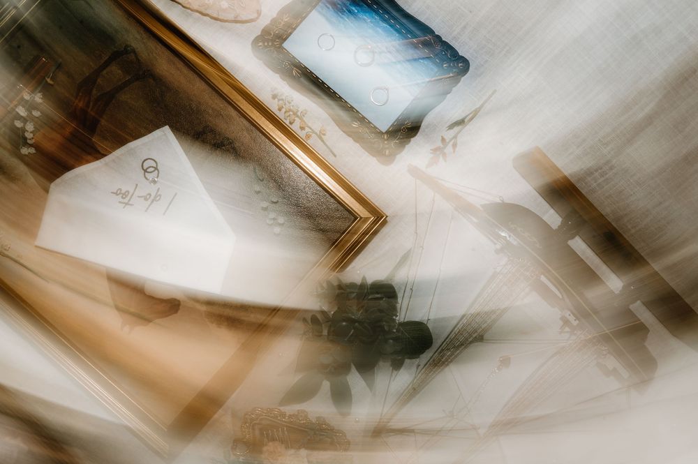 Abstract blurred motion photograph with soft beige and white tones creating an artistic effect.