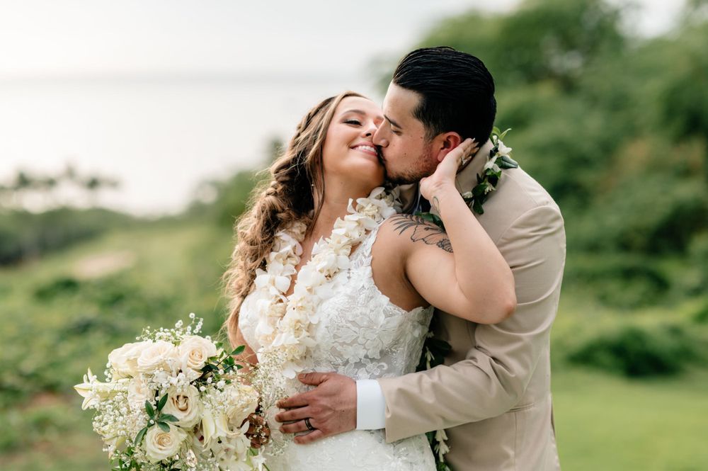 Intimate wedding portraits captured in lush tropical garden setting.