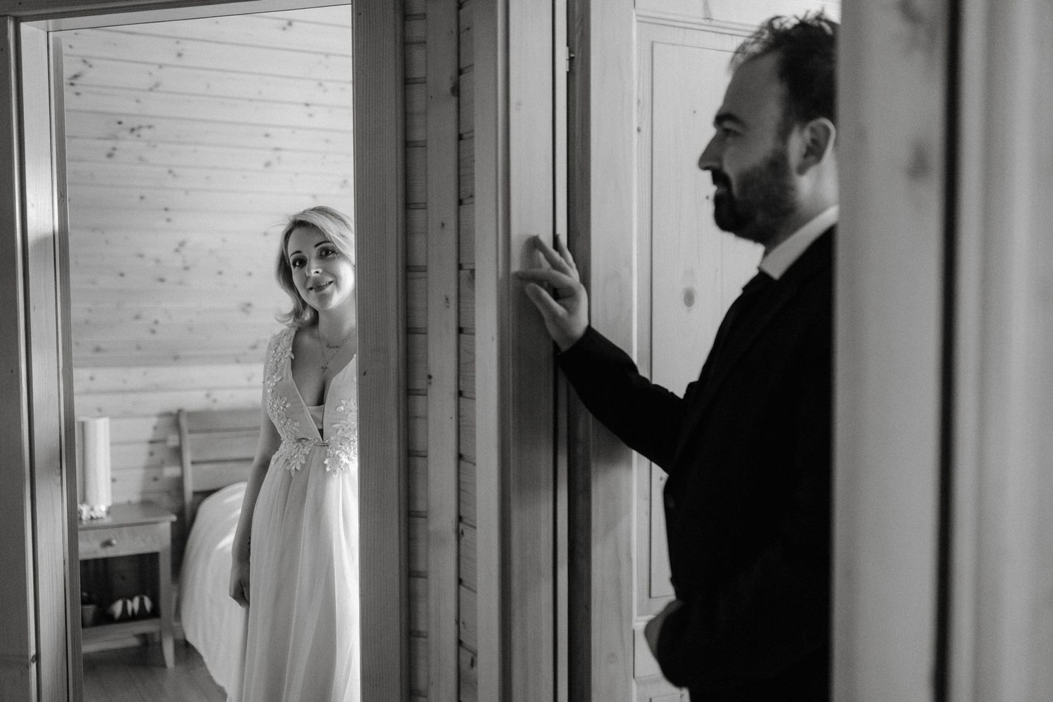 A black and white photo series showing a person standing in a doorway from different angles and perspectives.