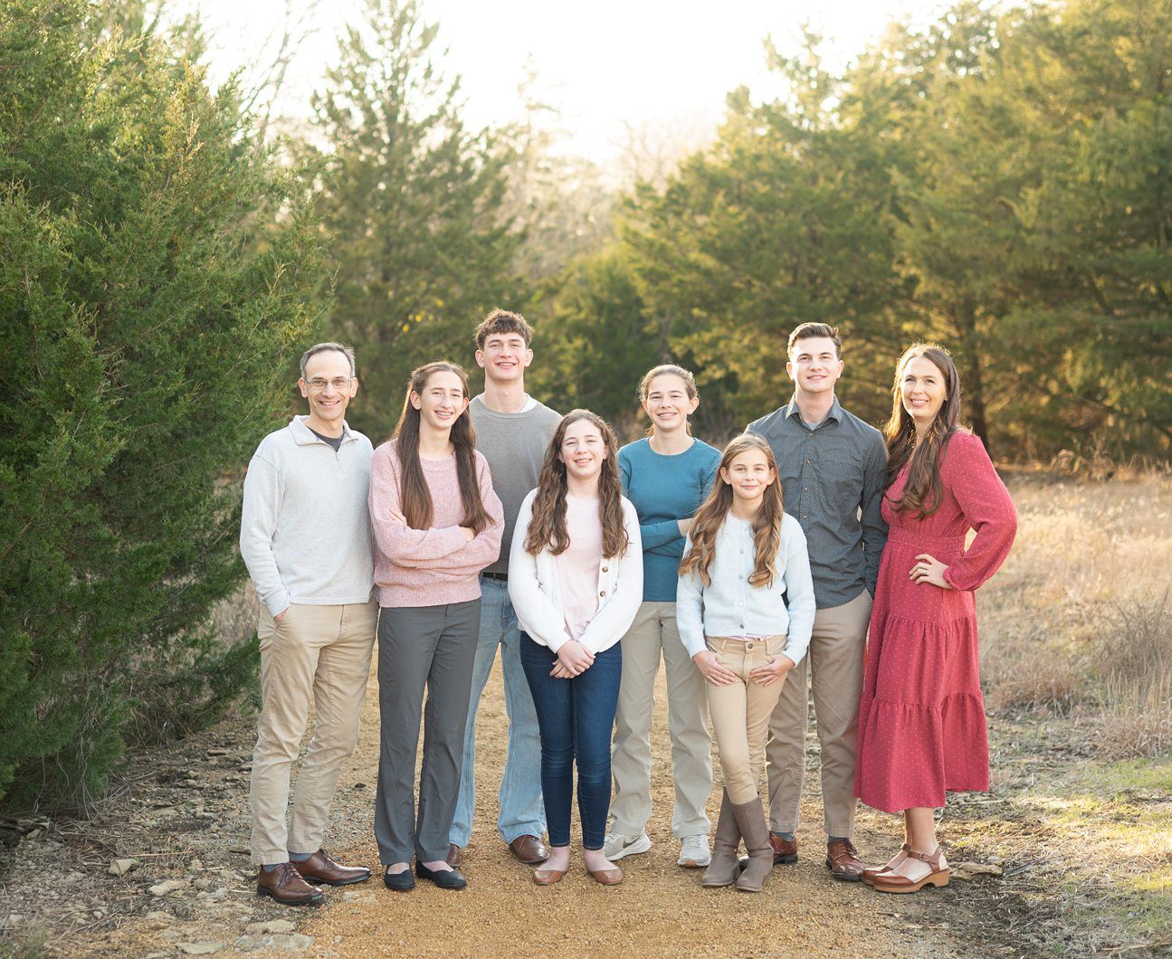 Family of 8 Portrait Session with Evergreens in Winter by Bartlesville Photographer Kristi Bray Photography