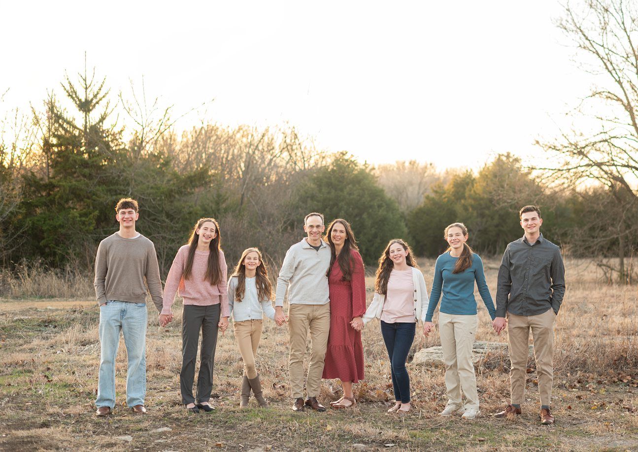 Family of 8 Portrait Session with Evergreens in Winter by Bartlesville Photographer Kristi Bray Photography