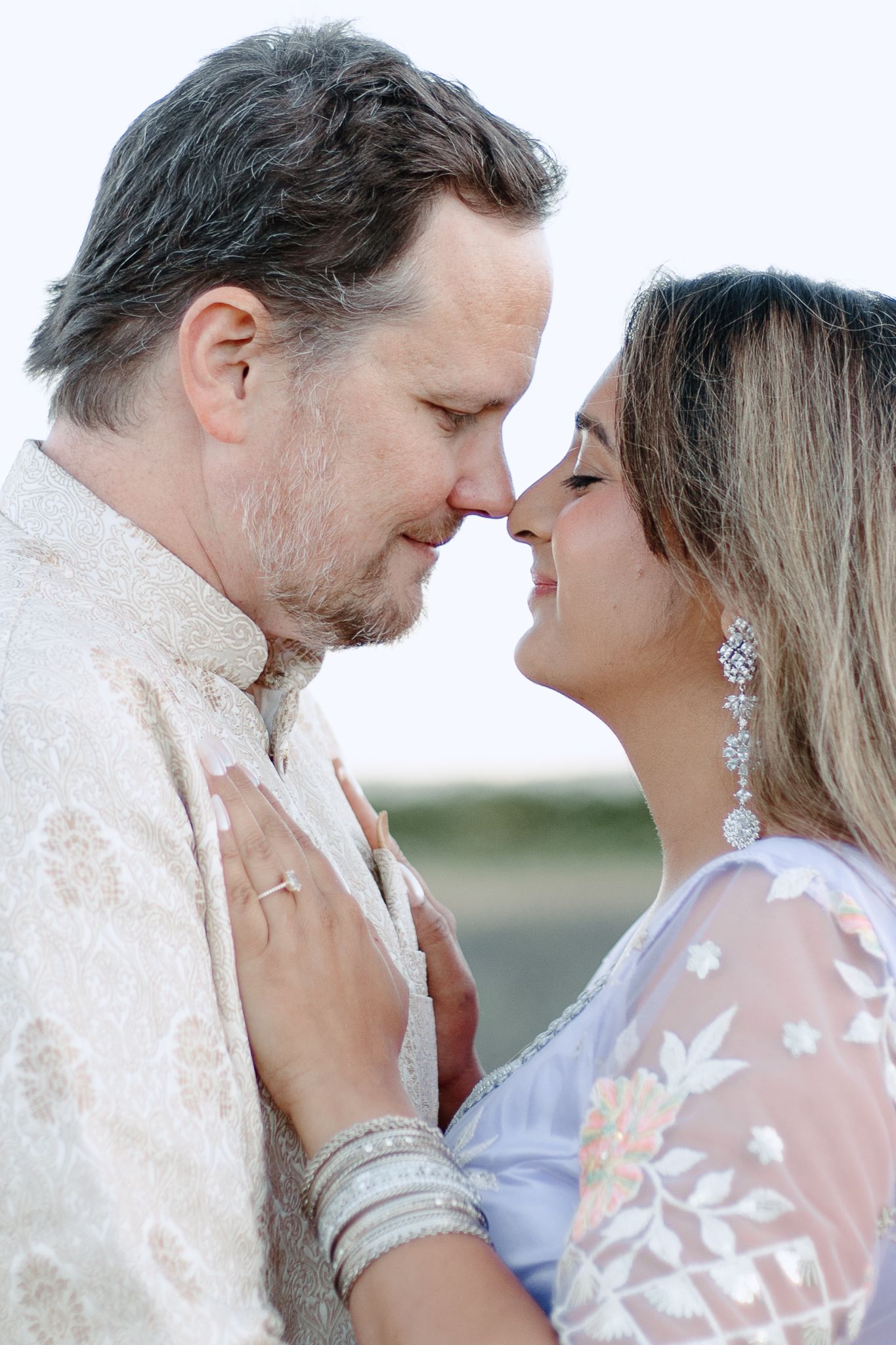 A romantic wedding couple shares an intimate moment in a series of four progressive close-up shots.