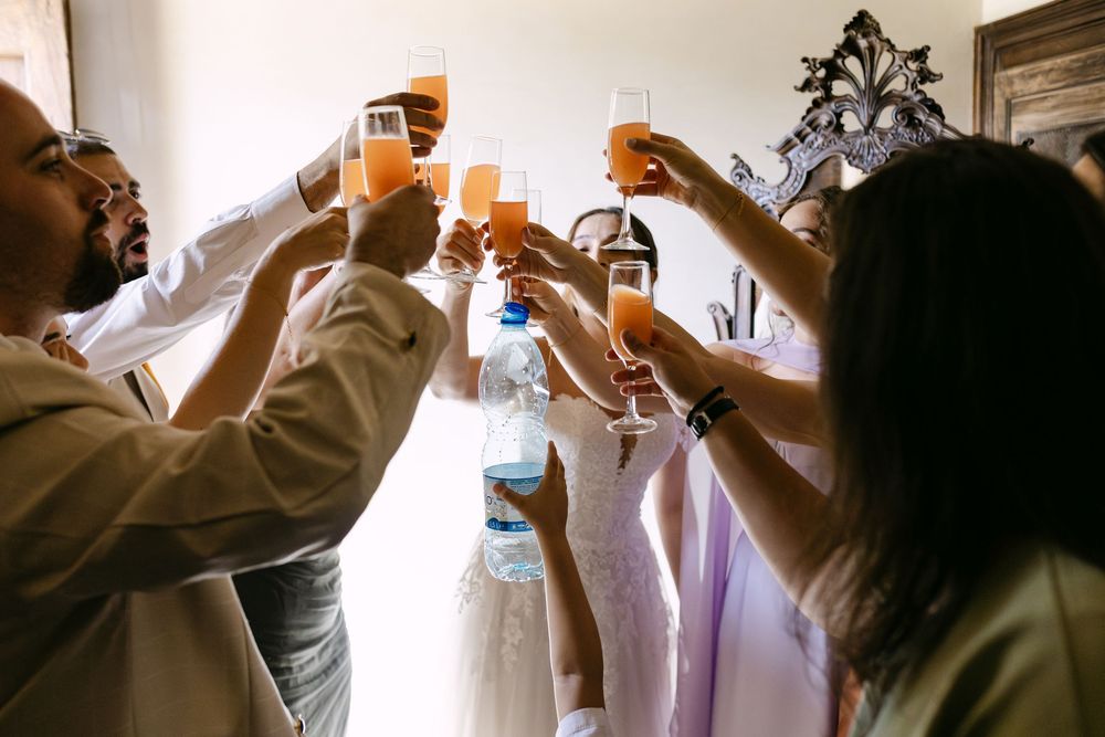 A funny toast between the bride and her friends at a wedding in Lisbon, while a child joins in with a glass of water
