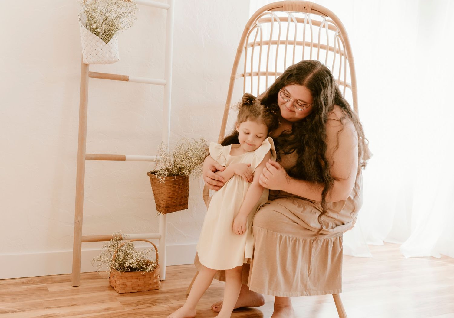 A tender moment between parent and child in a minimalist boho-styled room.