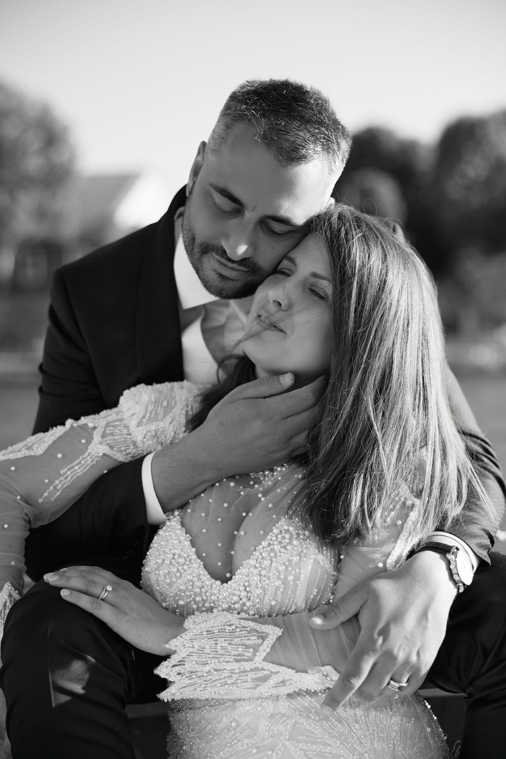 Black and white romantic wedding portraits showing tender moments between newlyweds.