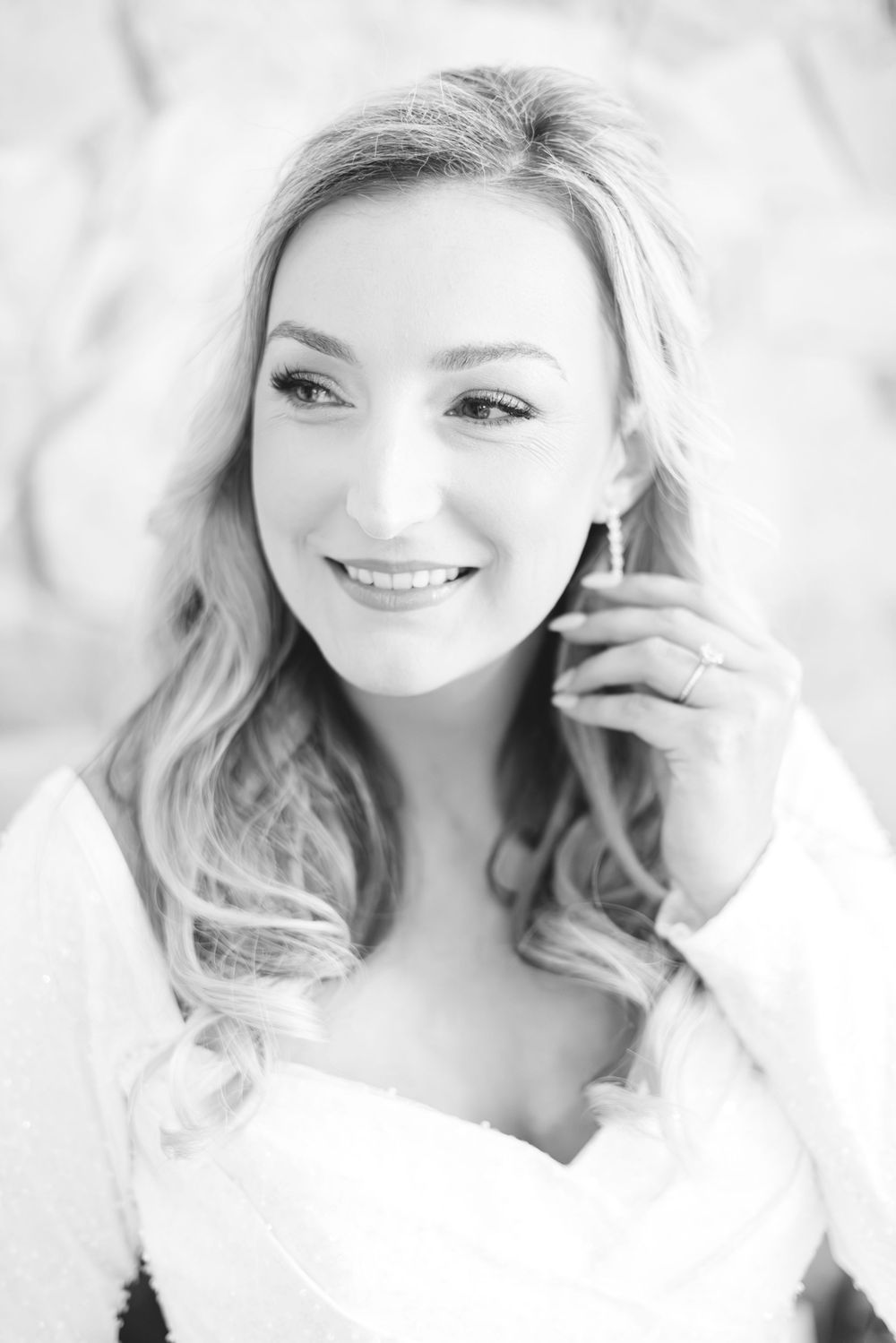 Soft, ethereal portraits with wavy blonde hair in white against a light background.