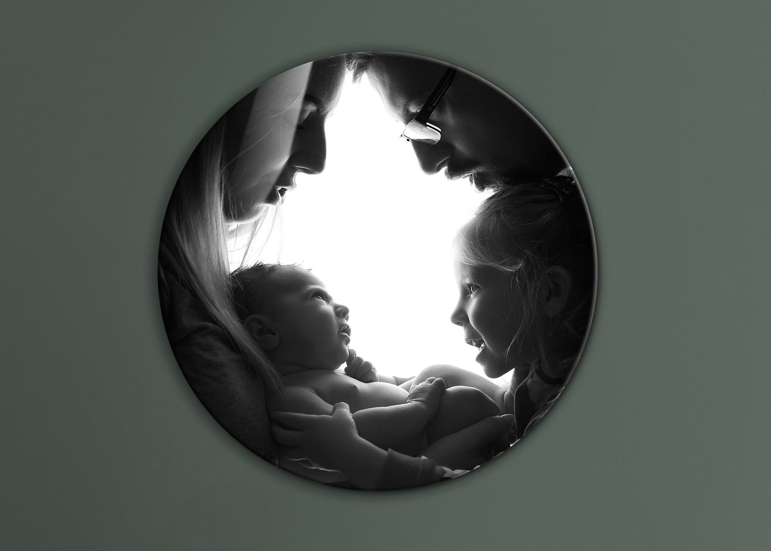 A series of five black and white images showing a gradual transition from a rectangular shape to an oval silhouette.