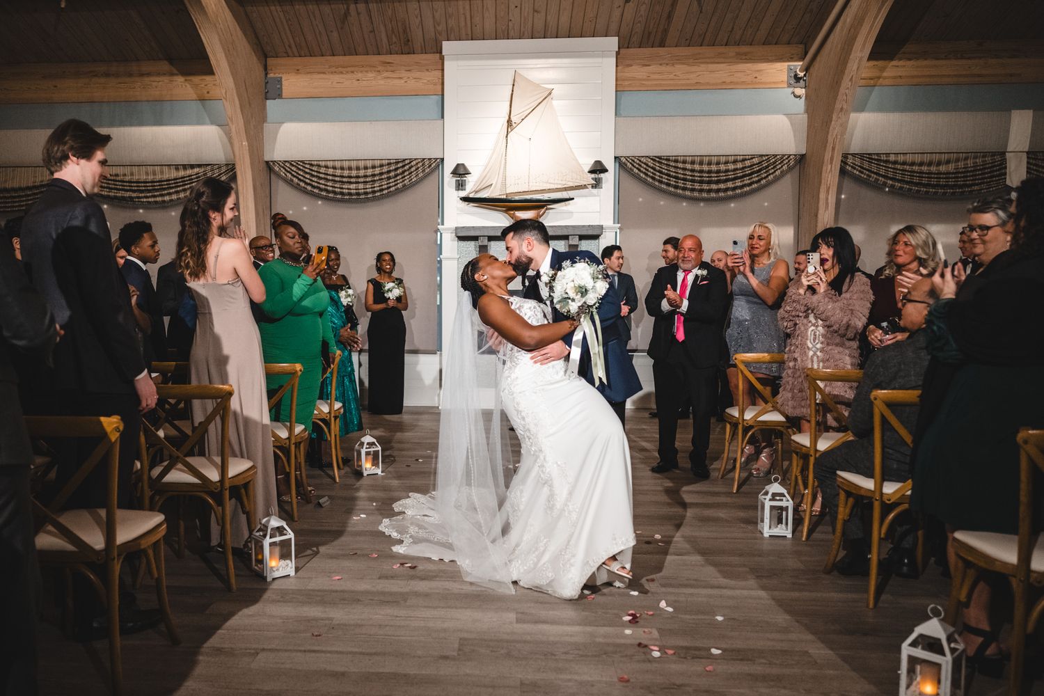 Wedding reception venue with wooden chairs set up for ceremony.