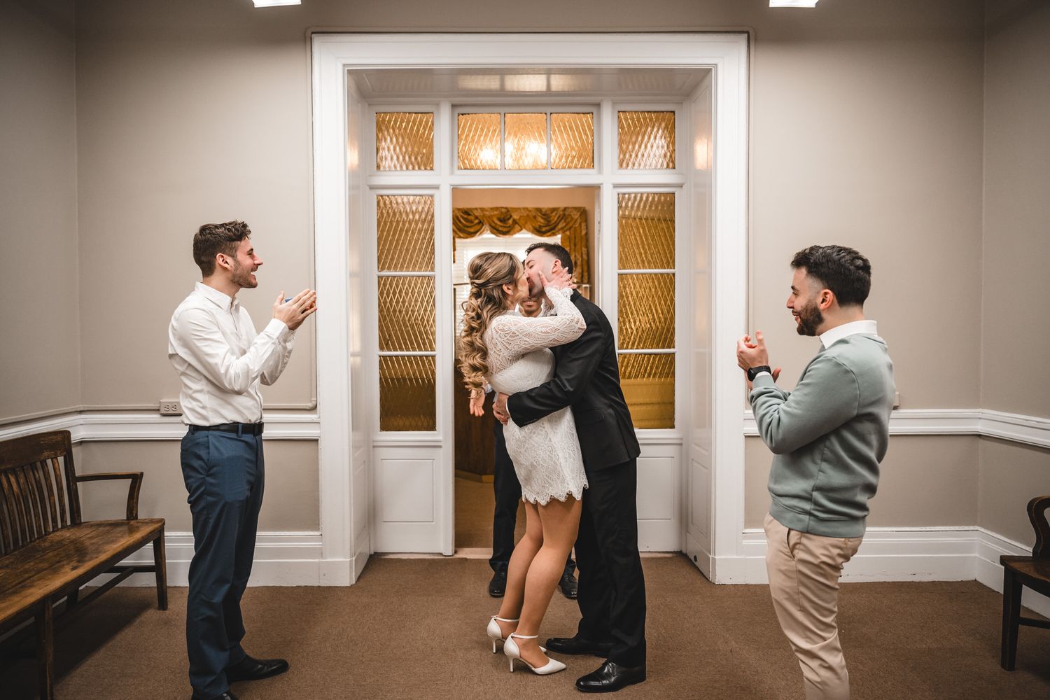 Series of romantic dance poses in an elegant white-trimmed hallway with wooden floors.