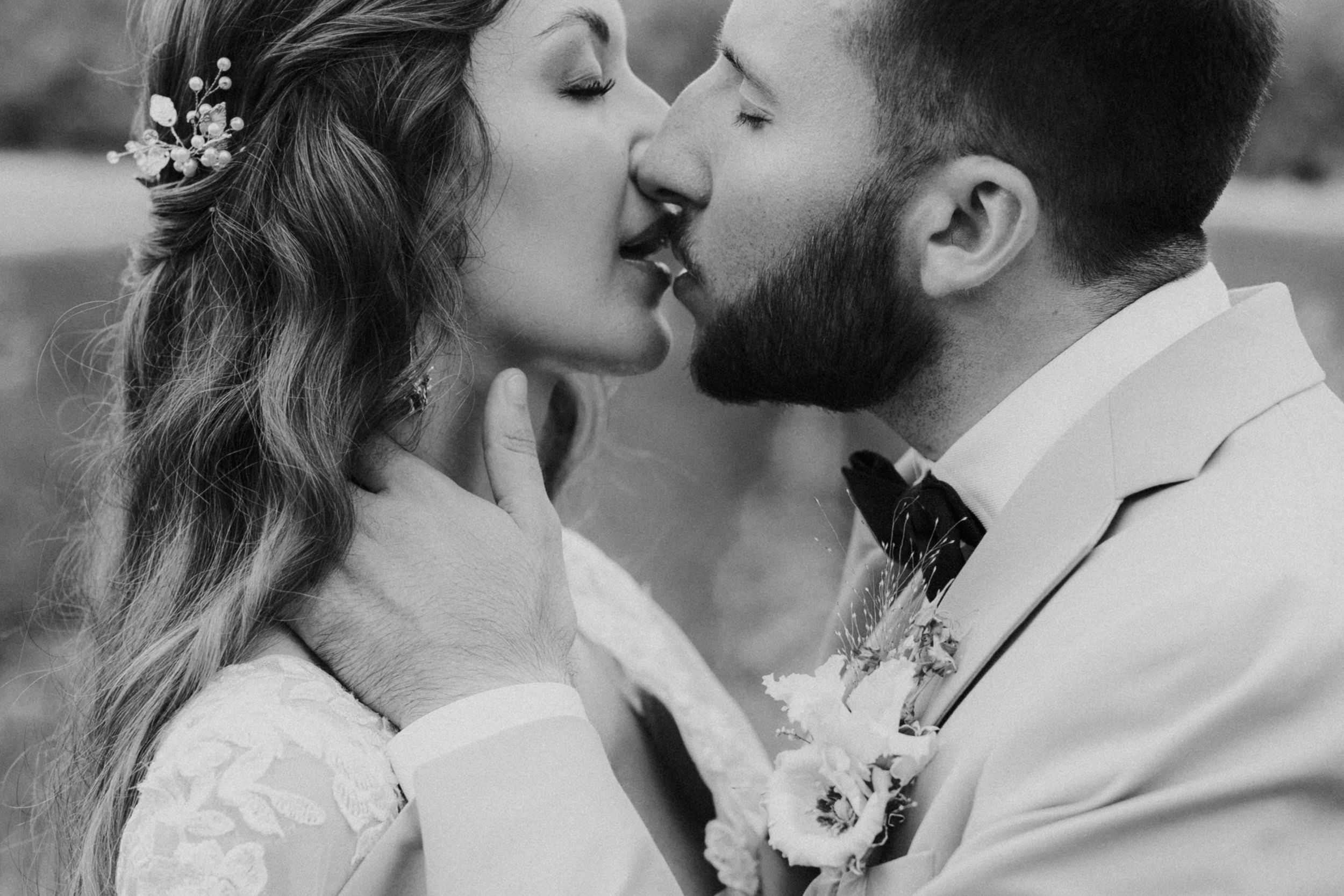 A romantic black and white photo series showing a couple kissing in various intimate poses.