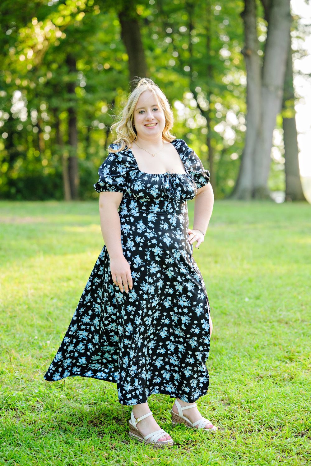 A high school senior wearing floral maxi dress with short puff sleeves and white sandals worn at Turkeyfoot Beach in Akron Ohio