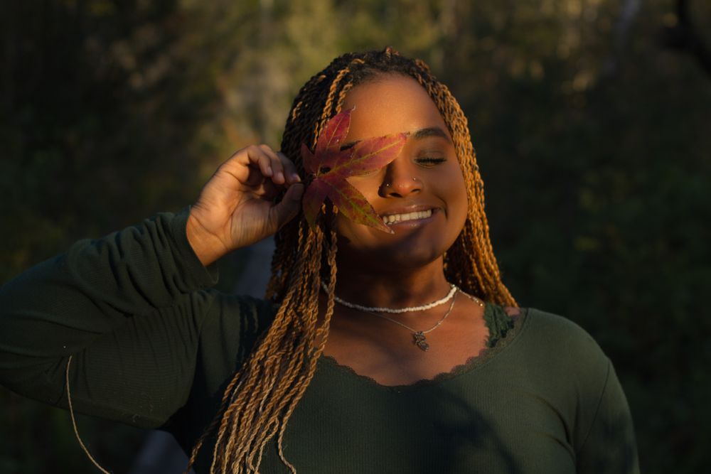 Autumn solo photoshoot in Lakeland, Florida, with vibrant fall colors, capturing a cozy and seasonal vibe with warm tones and natural beauty