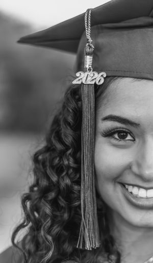 Black and white graduation portrait series showing close-up shots of someone wearing a cap with 2026 tassel. fort worth photographer. Dallas