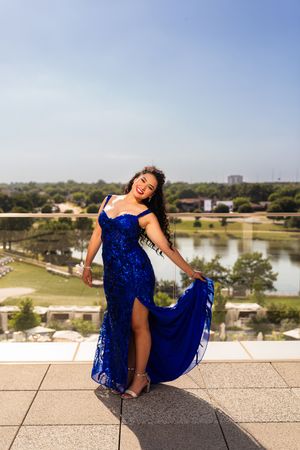 Young woman in royal blue prom dress. prom photos at Arlington Live hotel. Dallas Fort Worth photographer