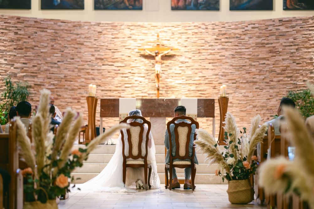 Couple facing the altar.