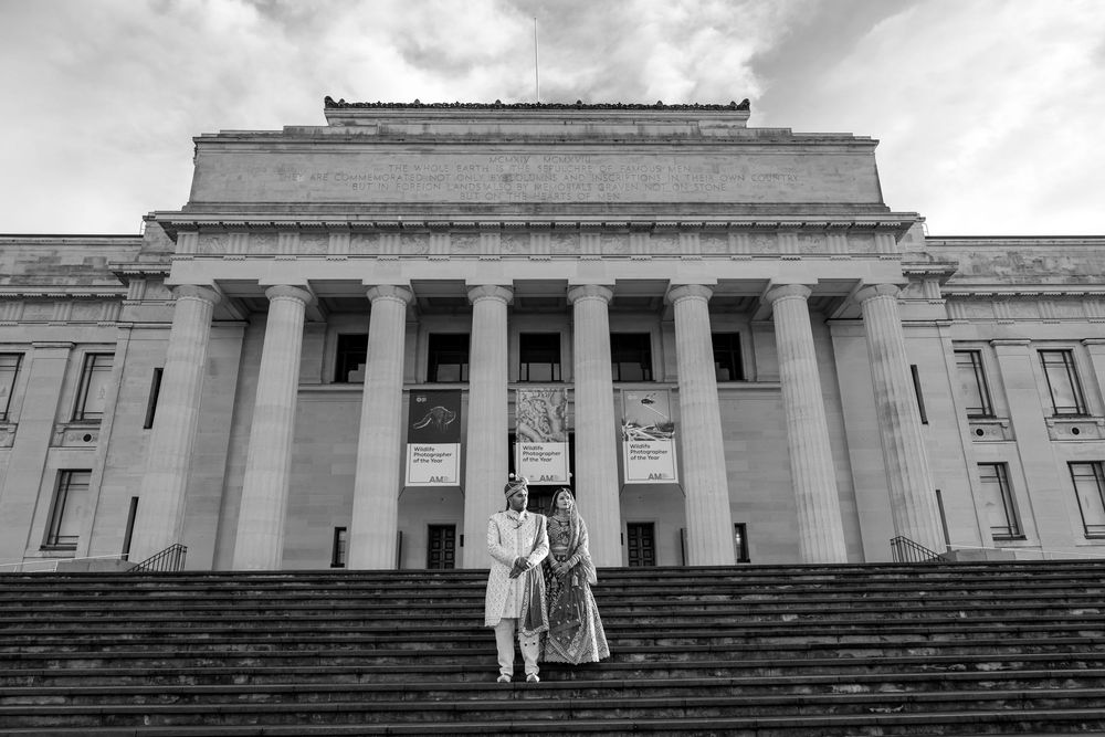 Black and white photograph of a classical building exterior with steps and columns.