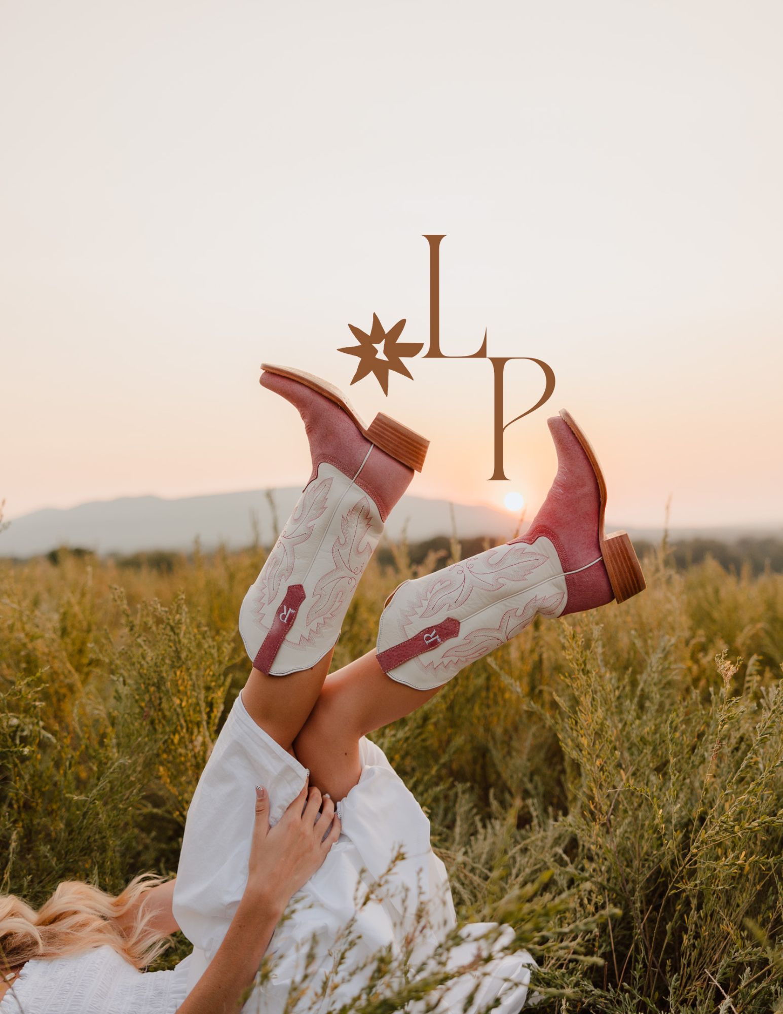 Brown leather boots sticking up from tall wildflowers at sunset creating a whimsical outdoor scene.