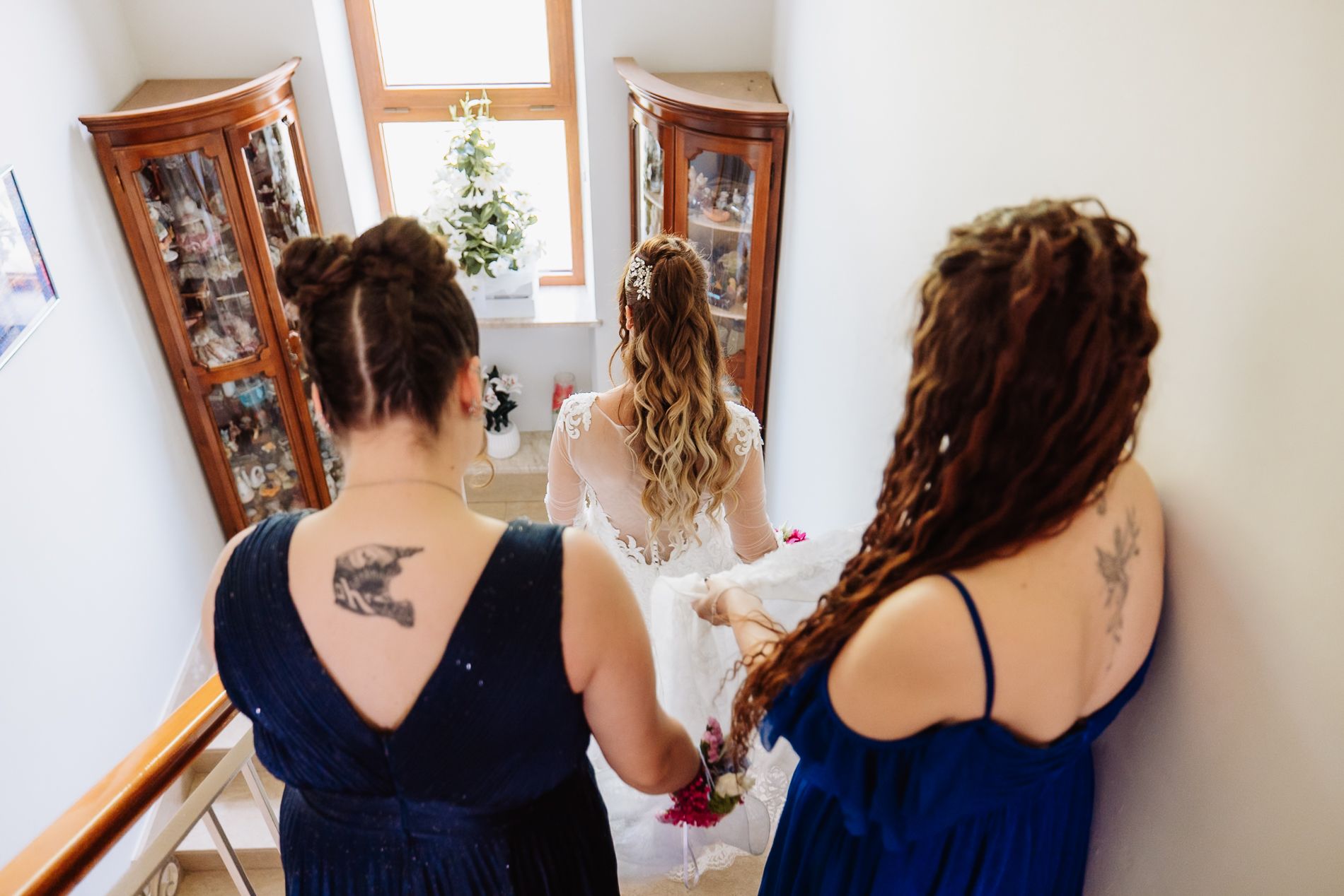 A series of five photos showing wedding preparation moments with bridesmaids in dark blue dresses.