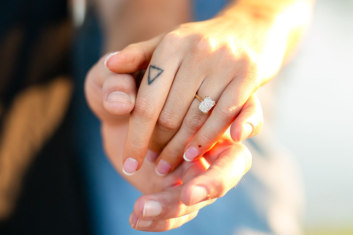 Close‑up of an engagement ring on a hand during a surprise proposal session in Mountain Home, Arkansas.