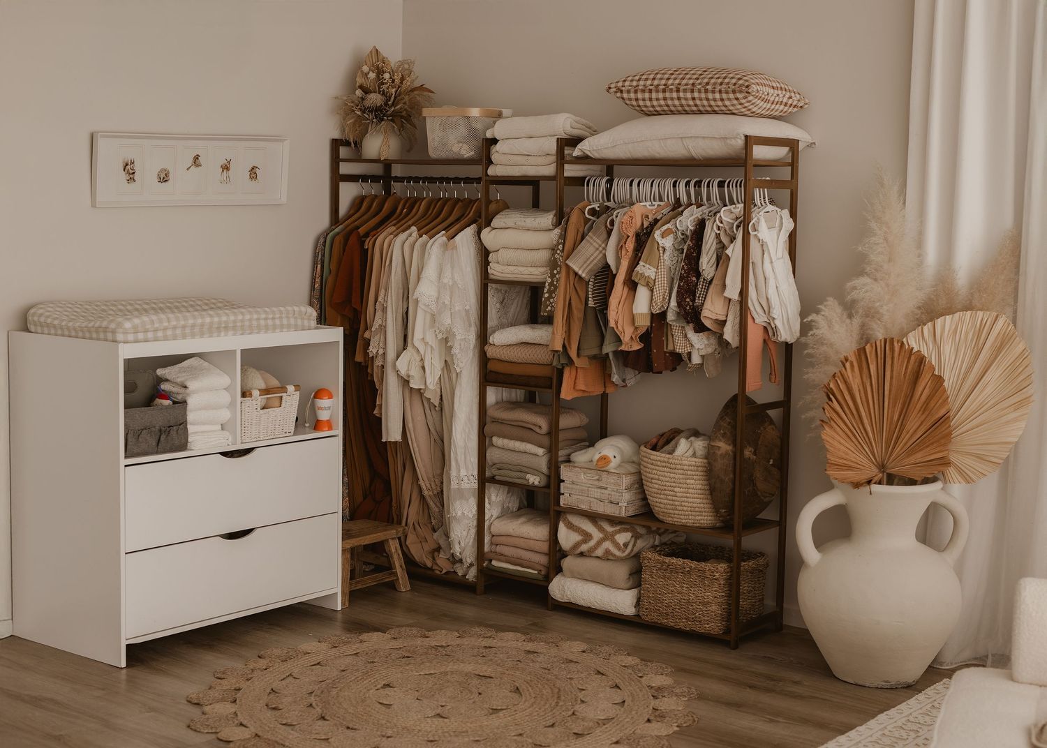 A neutral-toned nursery room with crib, changing table, and storage baskets arranged in a minimalist style.