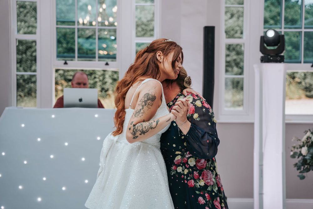 Mother and daughter dance at beautiful Rockbeare Manor summer wedding