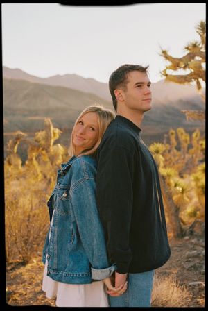 Couples engagement session on film in southern utah holding hands back to back