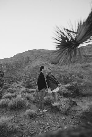 Couple kissing at engagement session taken on film in southern utah