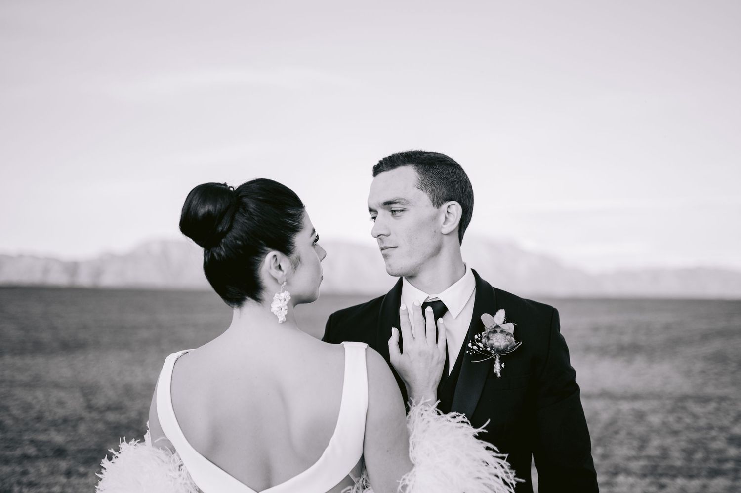 A series of romantic black and white wedding moments captured in a filmstrip-style sequence.