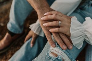 Couple holding hands at sunset | engagement photography