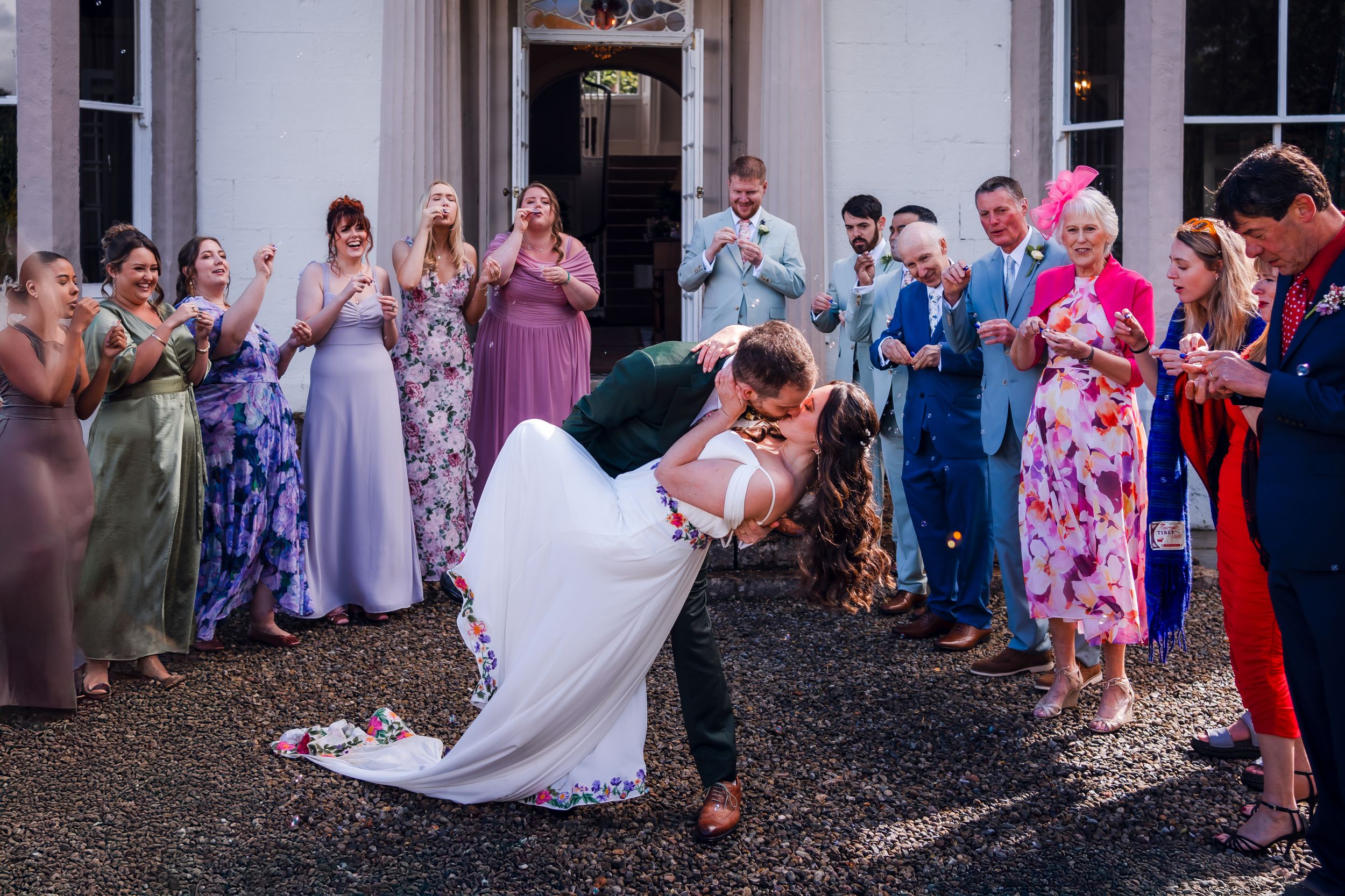 non-traditional wedding photographer in the Lake District - bride and groom dip kiss