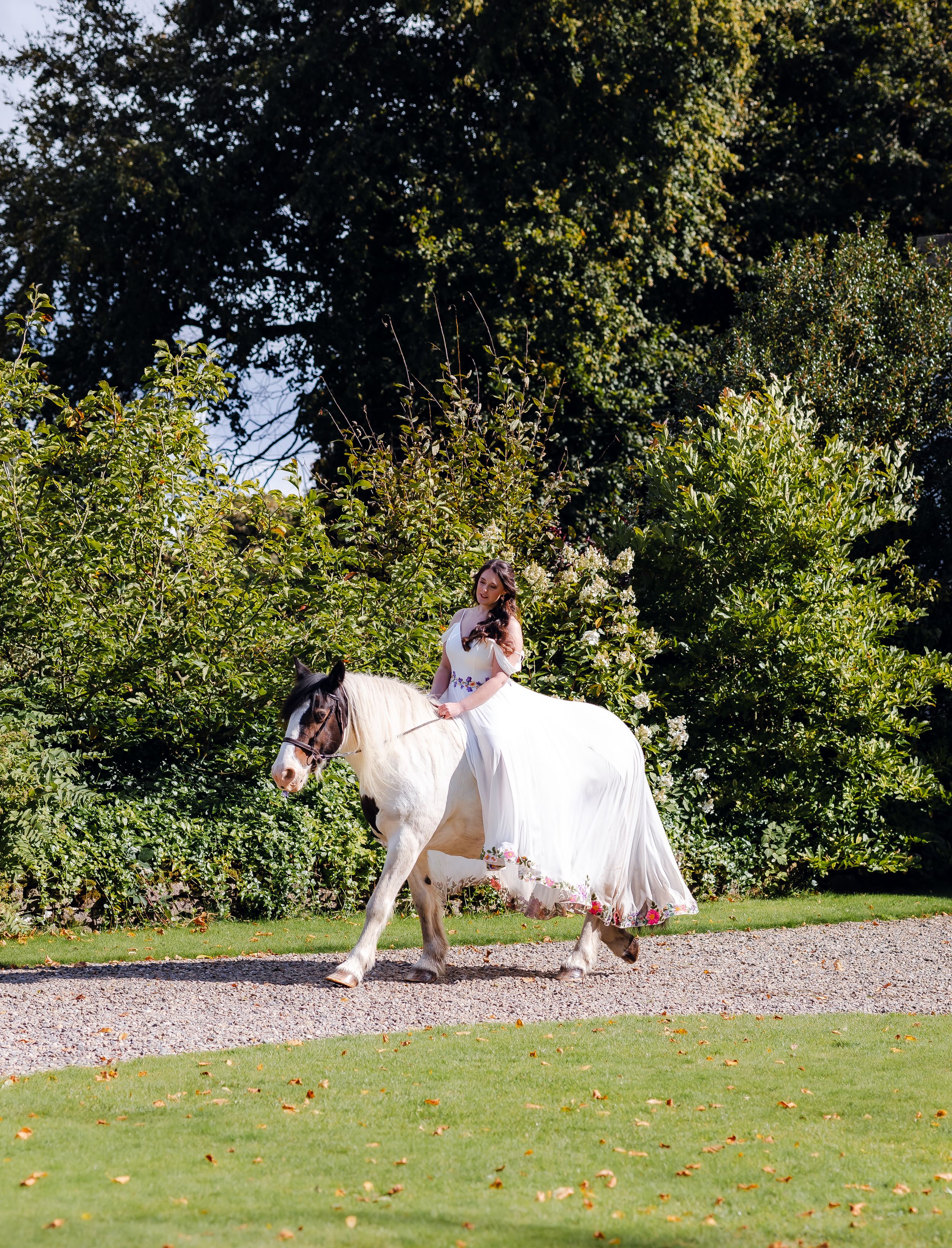 non-traditional wedding photographer in the Lake District - bride riding her horse