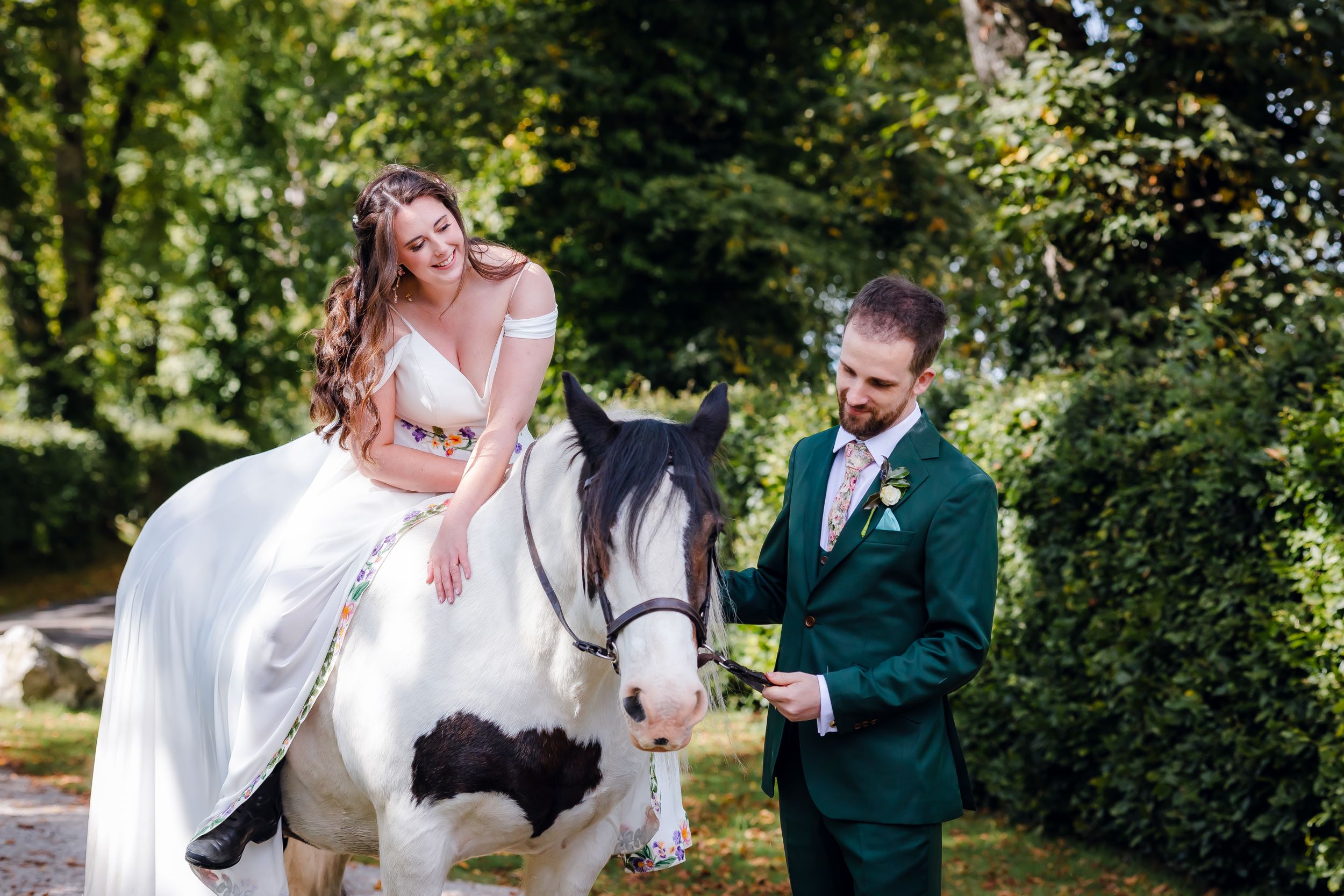 non-traditional wedding photographer in the Lake District - bride and groom portrait with horse