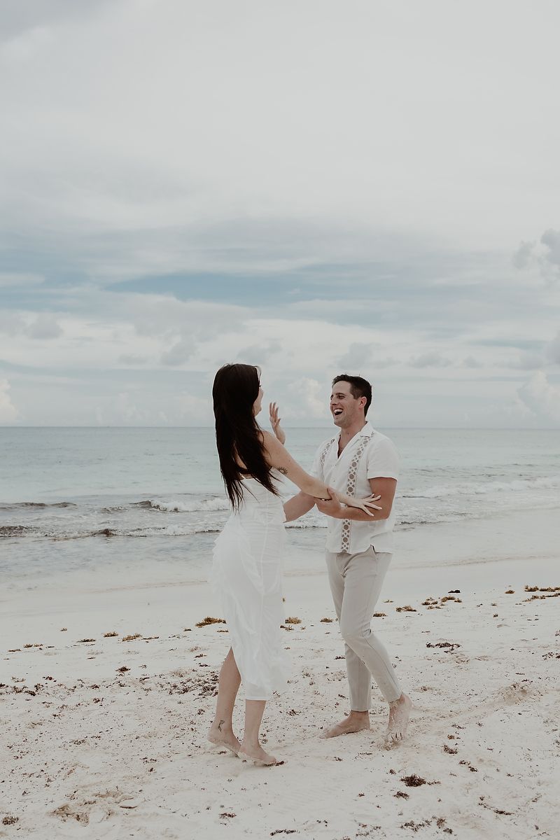 Surprise proposal captured during an editorial engagement photoshoot at Playa Xpu Ha.